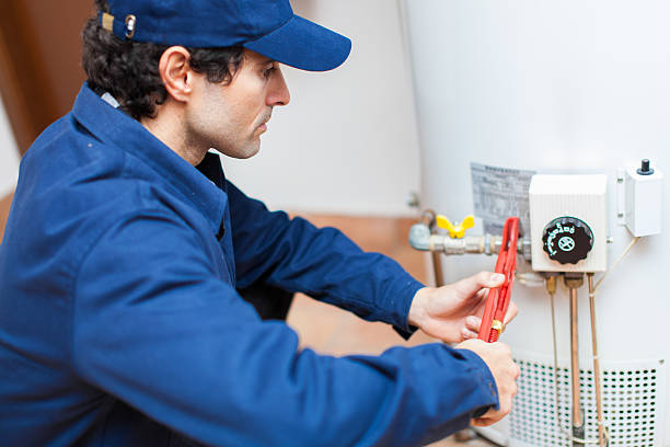 plumber fixing an hot water heater